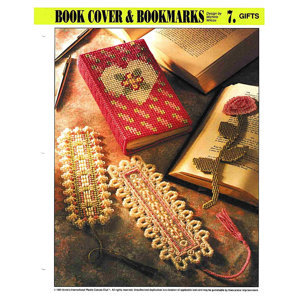 Vintage Plastic Canvas Pattern: Book Cover & Bookmarks. Charts included for floral bookcover in 7-mesh, rose bookmark in 10-mesh, Taos bookmark in 7-mesh, and eyelet bookmark in 10-mesh. 