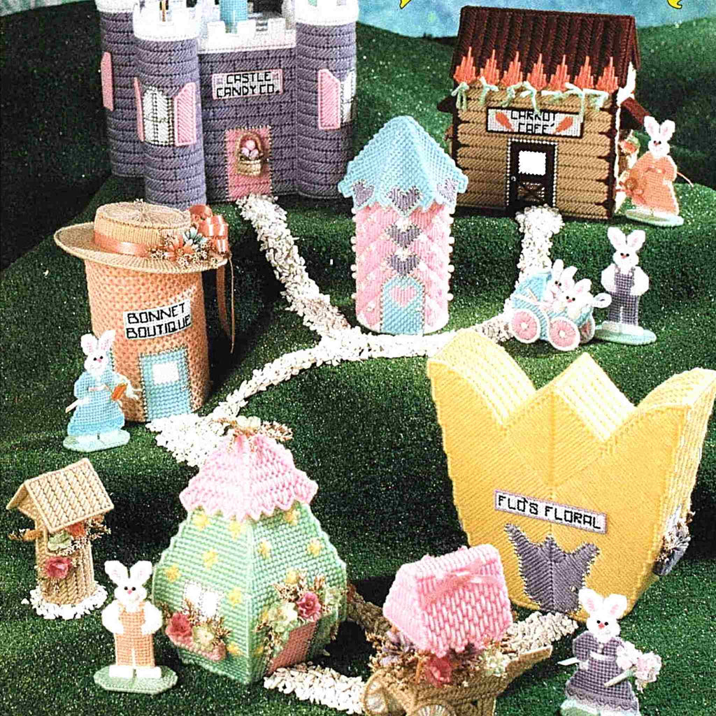 Vintage Easter Plastic Canvas Pattern: Bunny Boulevard.  Hop into Spring and Easter with this adorable 11-piece bunny village to be made using yarn, 7-count plastic canvas, and 10-count plastic canvas. detail