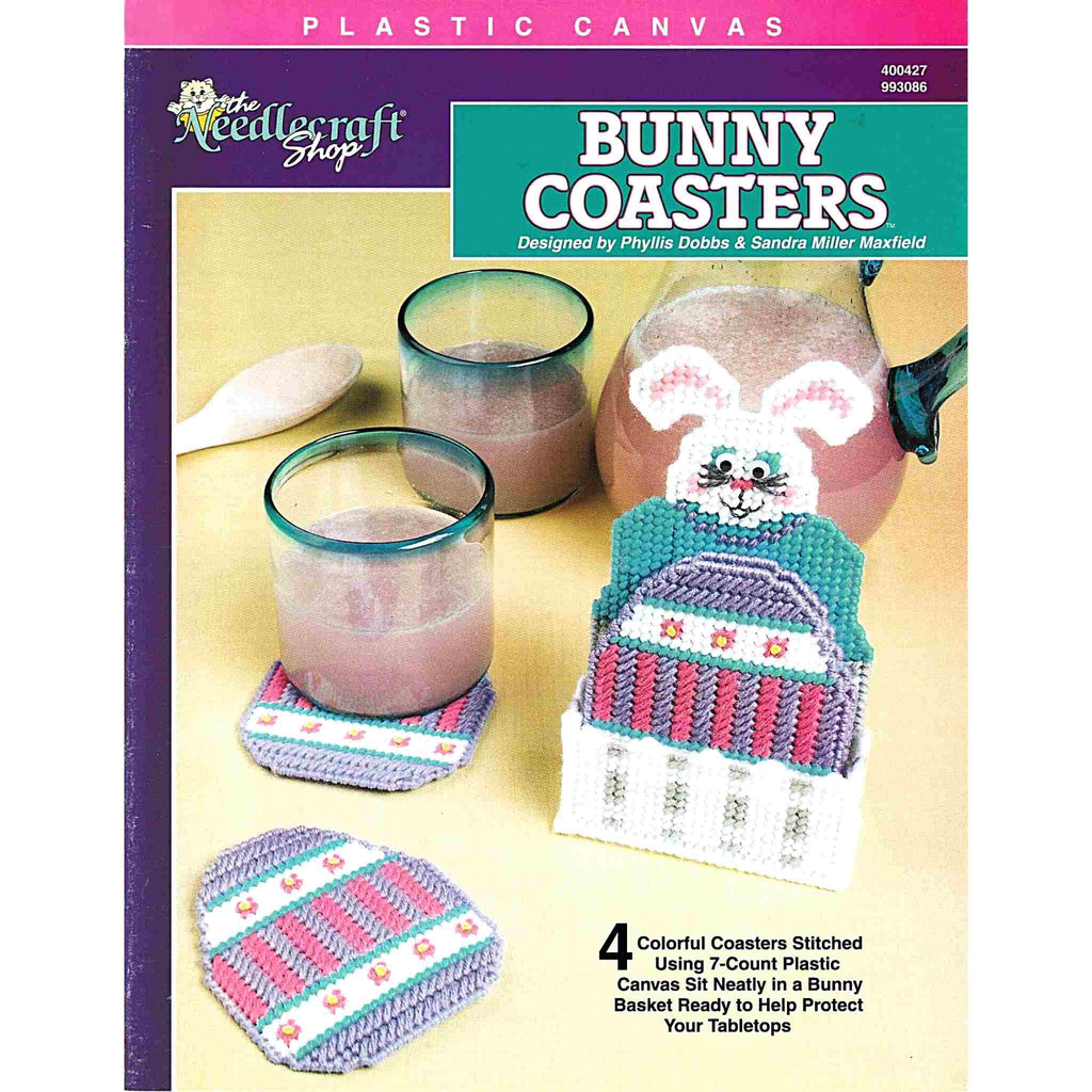 Vintage Easter Plastic Canvas Pattern: Bunny Coasters.  Four colorful Easter egg coasters sit neatly in a bunny basket, made using 7-count plastic canvas + worsted weight yarn. 