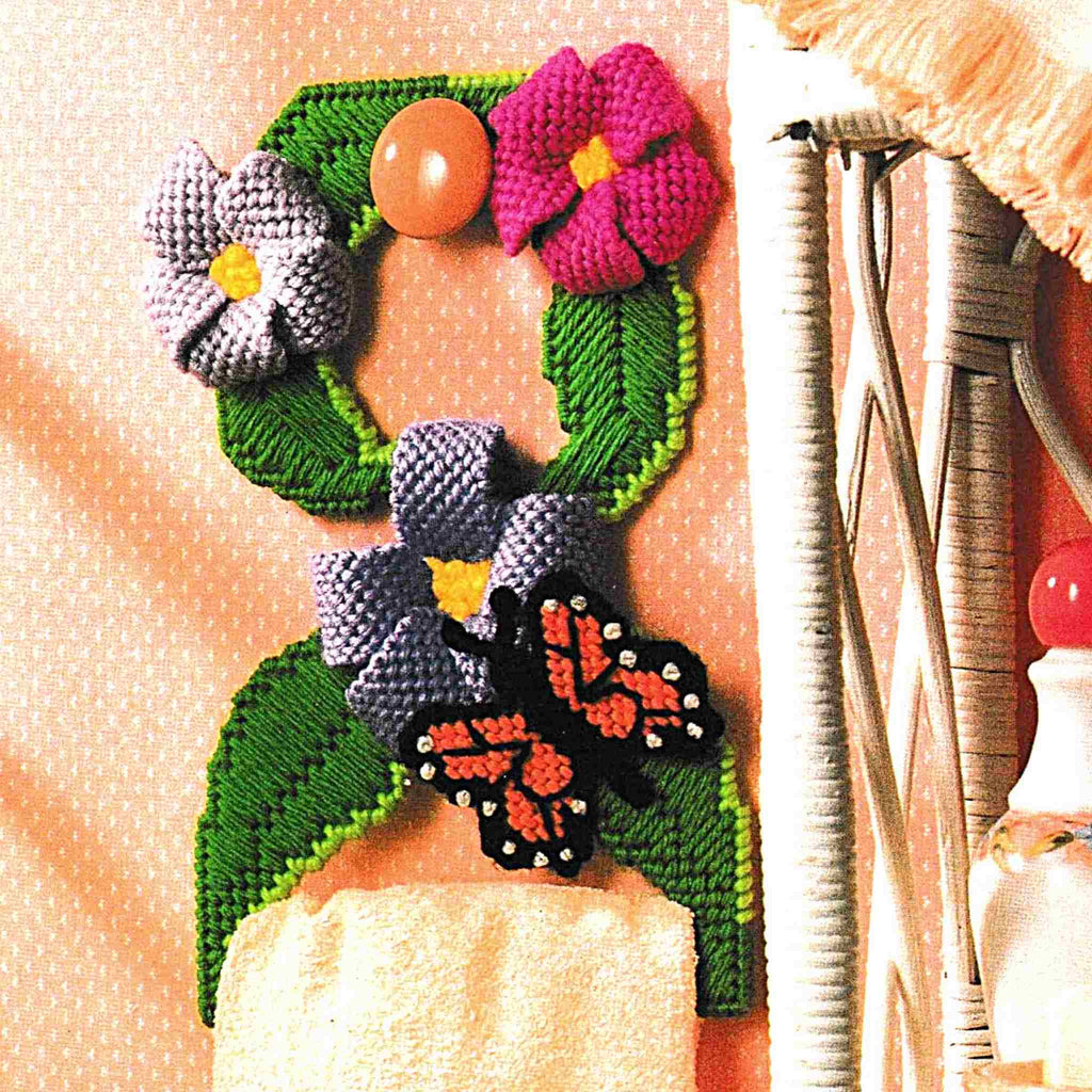 Vintage Plastic Canvas Pattern: Butterfly Towel Holder. Basic materials you'll need are 7-count plastic canvas sheets and worsted/ #4 medium-weight yarn. 