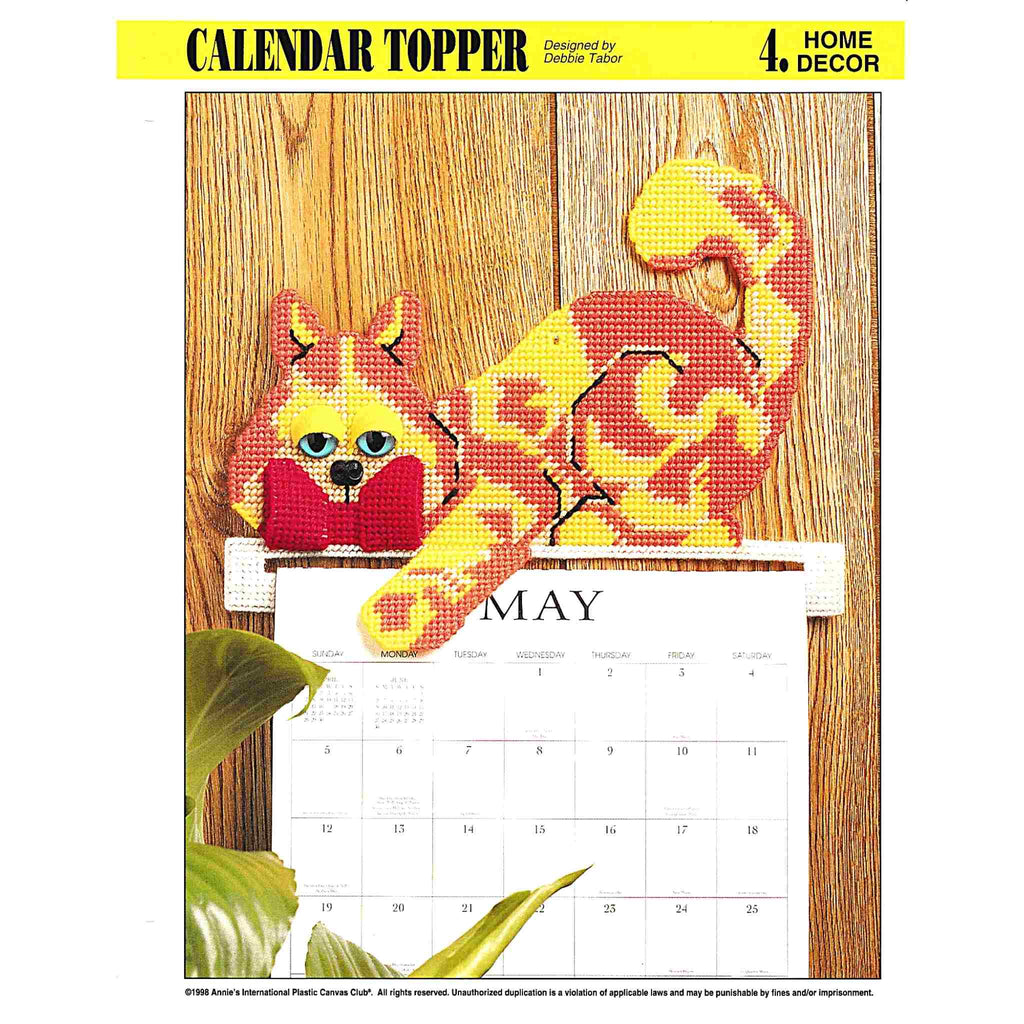 Vintage Plastic Canvas Pattern: Calendar Topper. Create a cute kitty cat calendar topper out of 7-count plastic canvas sheets and worsted / medium-weight yarn.