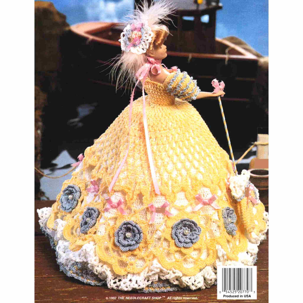 Vintage Fashion Doll Thread Crochet Pattern: Ladies of Fashion, Deborah of St Louis. This captivating dress is a vision of refined elegance with yellow overlay and embellished with a ring of blue flowers and pretty pink bows, stitched using size-10 bedspread cotton for your 11-½" fashion doll. 