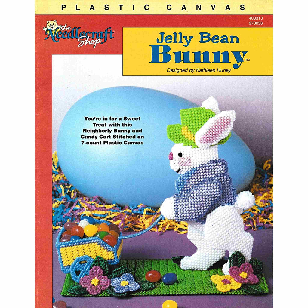 Vintage Easter Plastic Canvas Needlecraft Pattern: Jelly Bean Bunny.  You're in for a sweet treat with this neighborly bunny and candy cart to be made using worsted-weight yarn and 7-count plastic canvas. cover