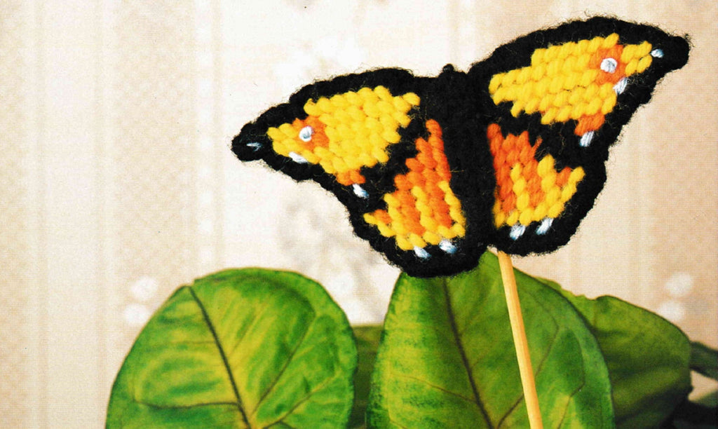 Vintage Plastic Canvas Pattern: Butterfly Magnets & Plant Pokes. Basic materials you'll need are 7-count plastic canvas sheets and worsted/ #4 medium-weight yarn. plant pick detail